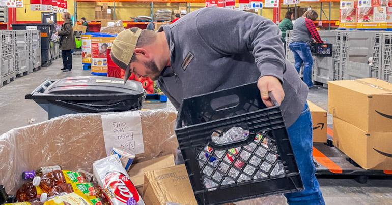 ELC Justin Nichols sorts soda at Harvesters 200,000 square foot Warehouse