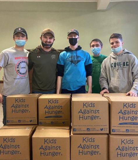 Five brothers from Iota Chapter helped box 30,000 meals in the "Rally to Fight Hunger" event.