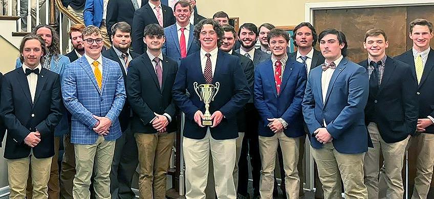 group alpha gamma rho members at alpha upsilon chapter holding trophy